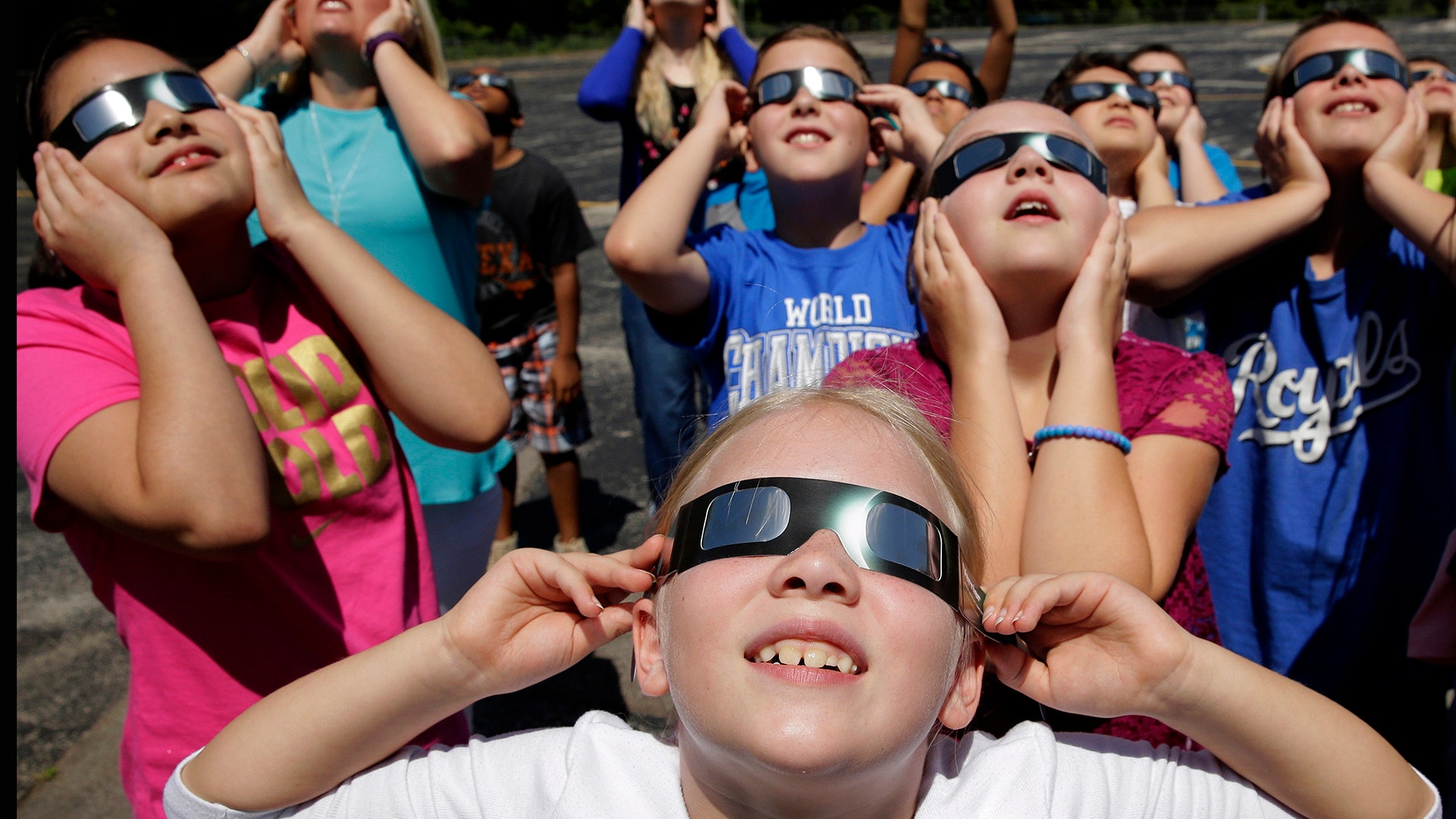 Fourth graders at Clardy Elementary School in Kansas City, Mo. practice the proper use of their eclipse glasses, August 18