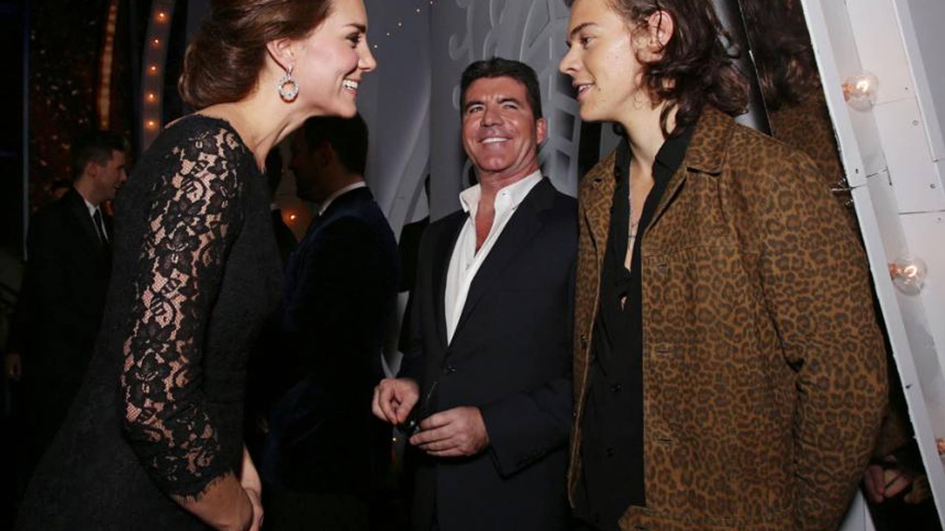 Chatting as Simon Cowell Looks On