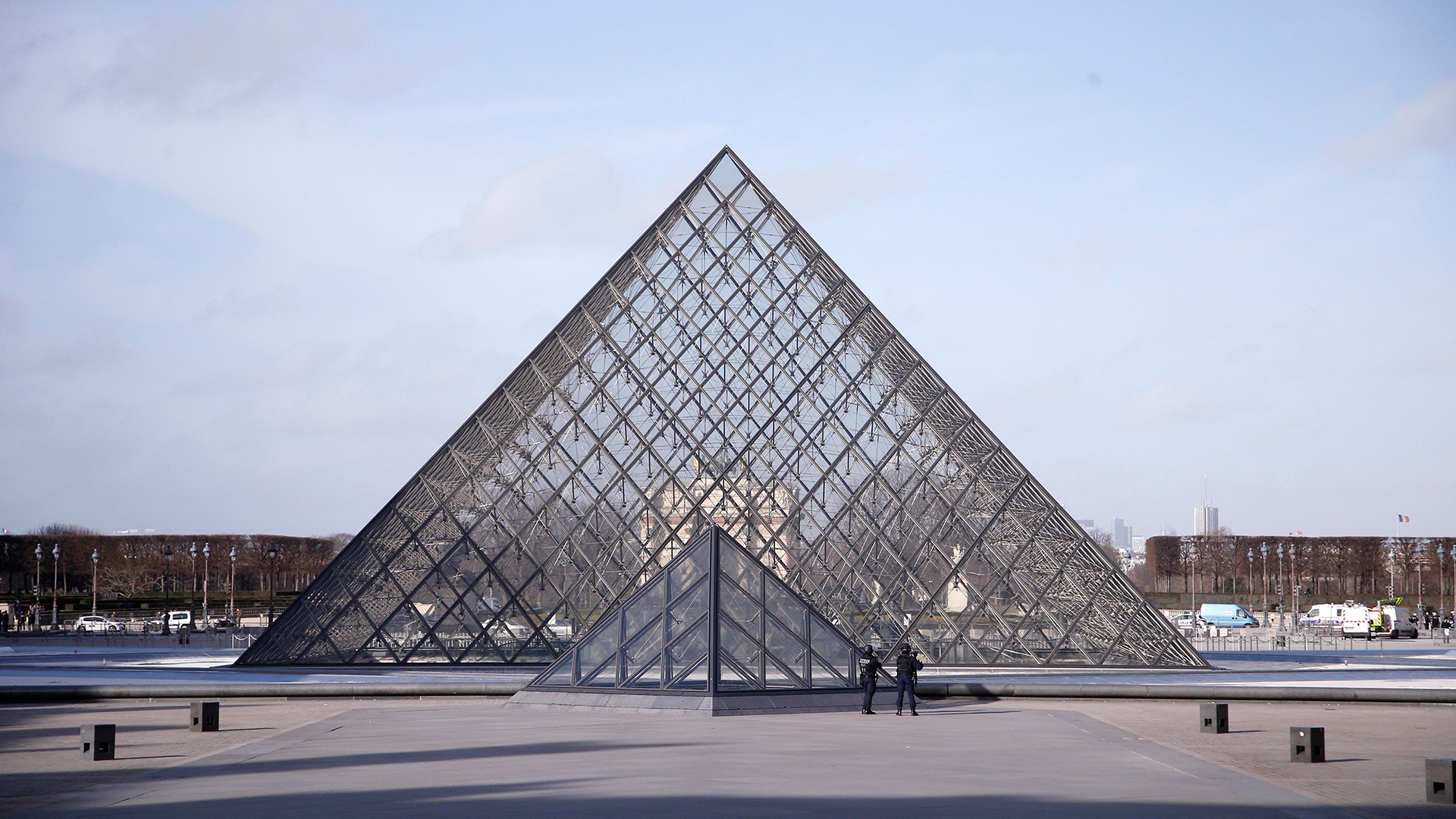 Police officers patrol at the pyramid outside the Louvre museum in Paris, police say a soldier has opened fire outside the Louvre Museum after he was attacked by someone, and the area is being evacuated.