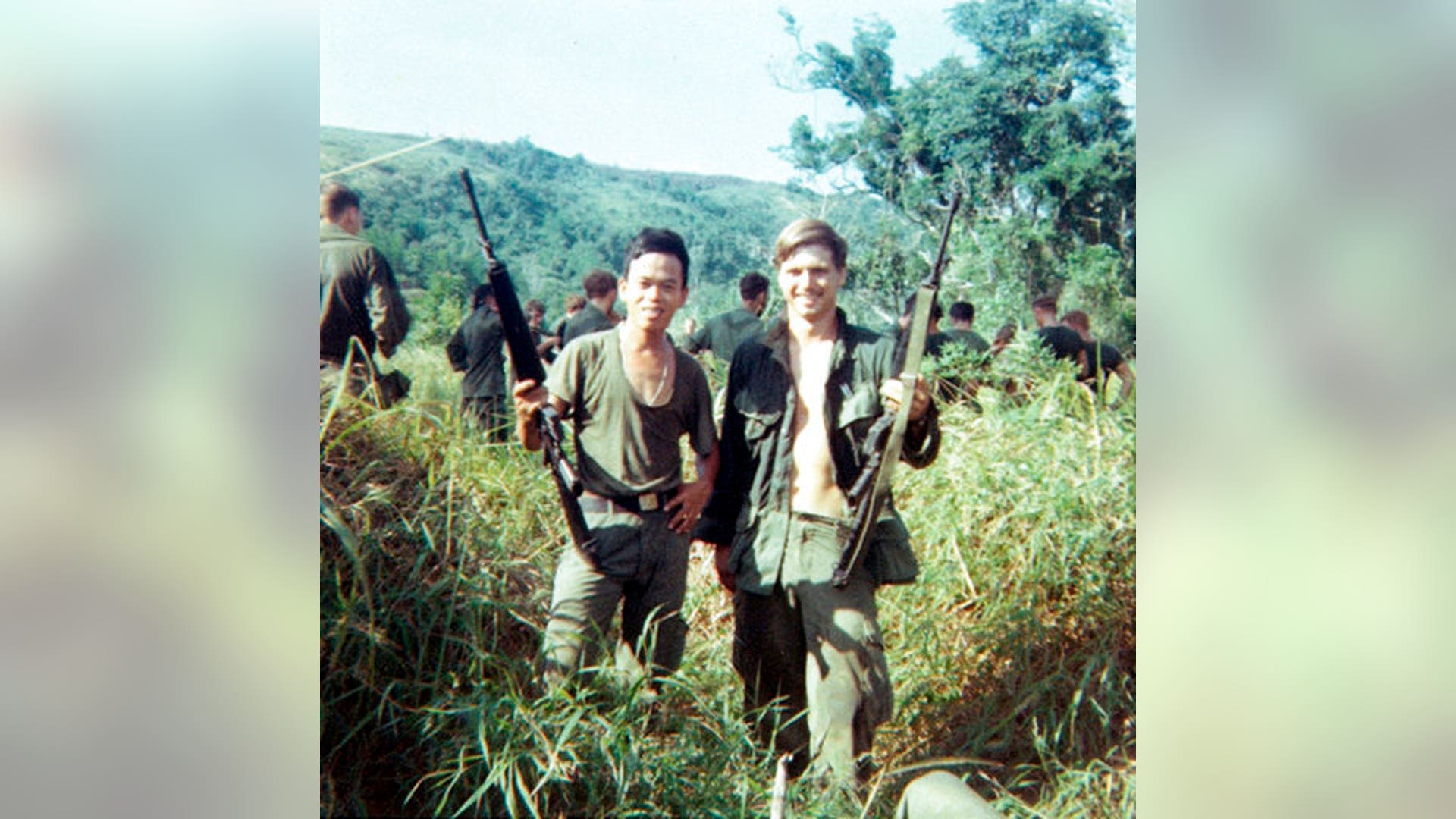 James McCloughan, right, with a platoon interpreter in Nui Yon Hill in Vietnam, in 1969