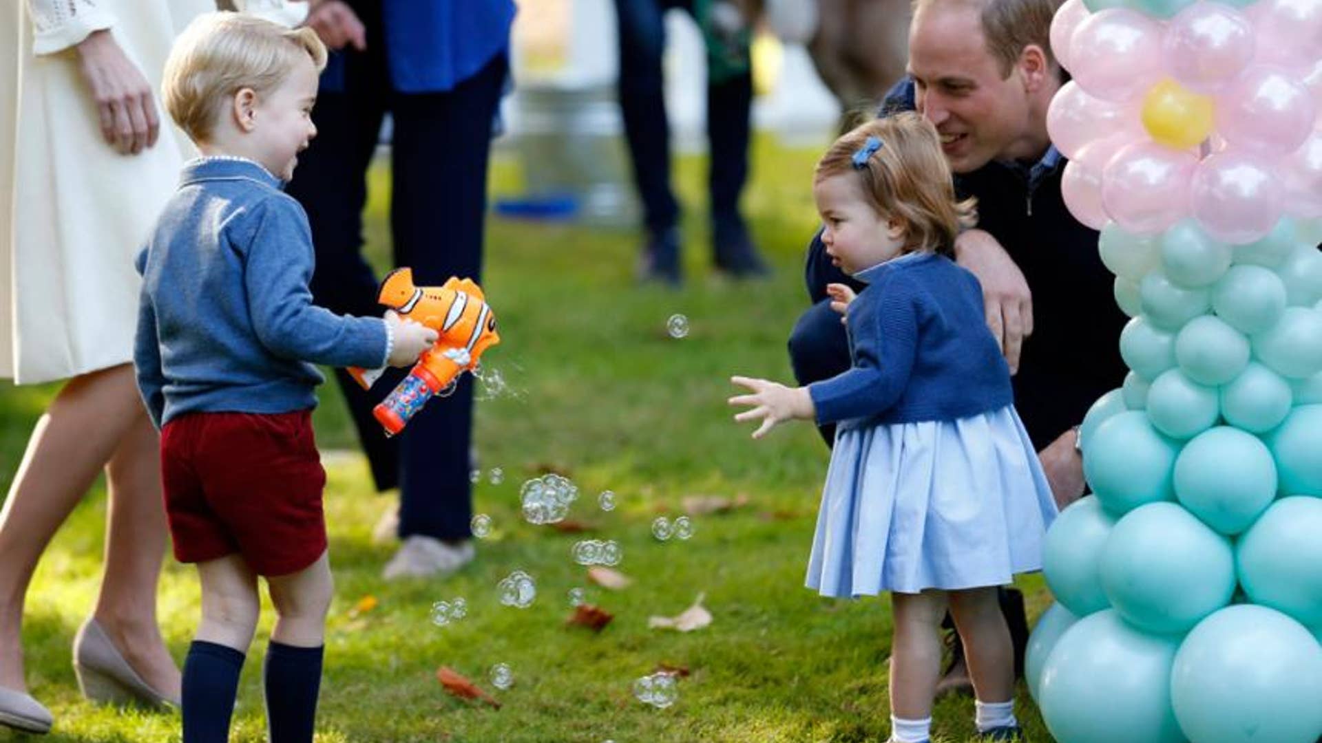 He tries to impress his little sister with some bubbles.
