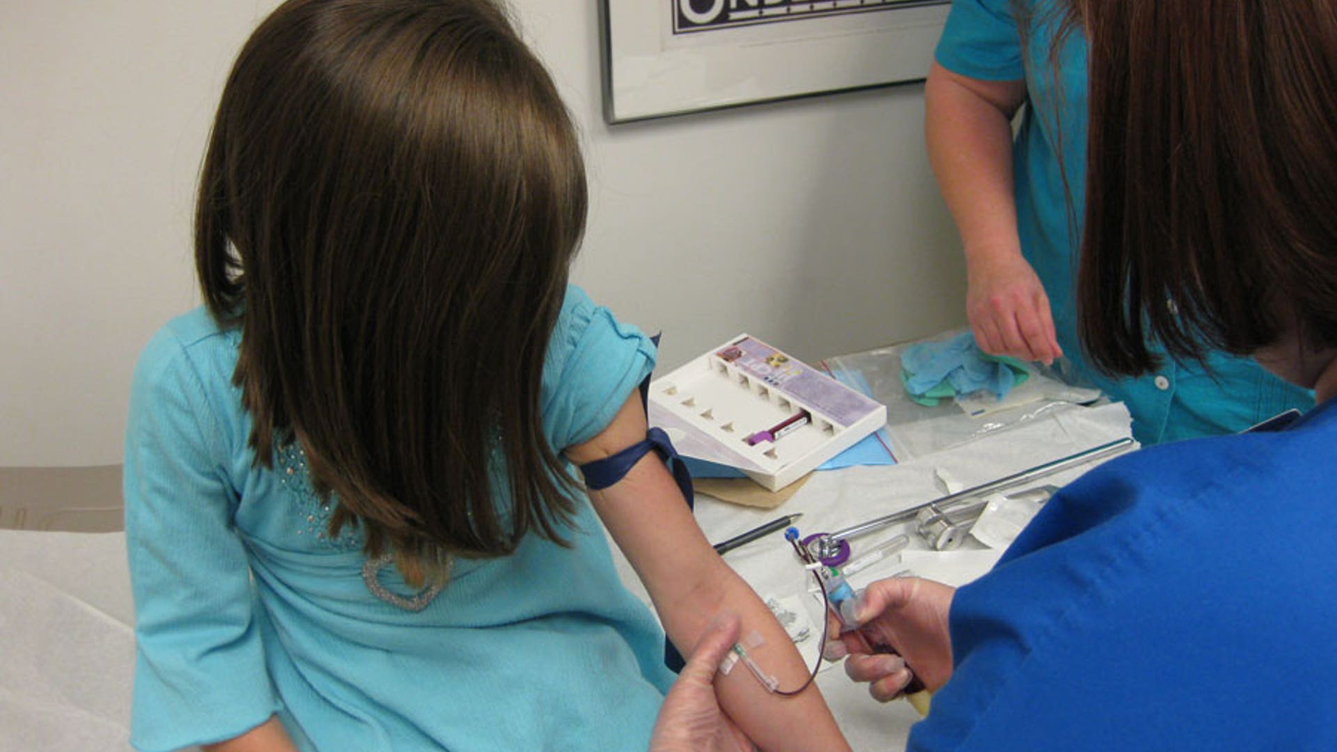 Researchers take a blood sample for analysis