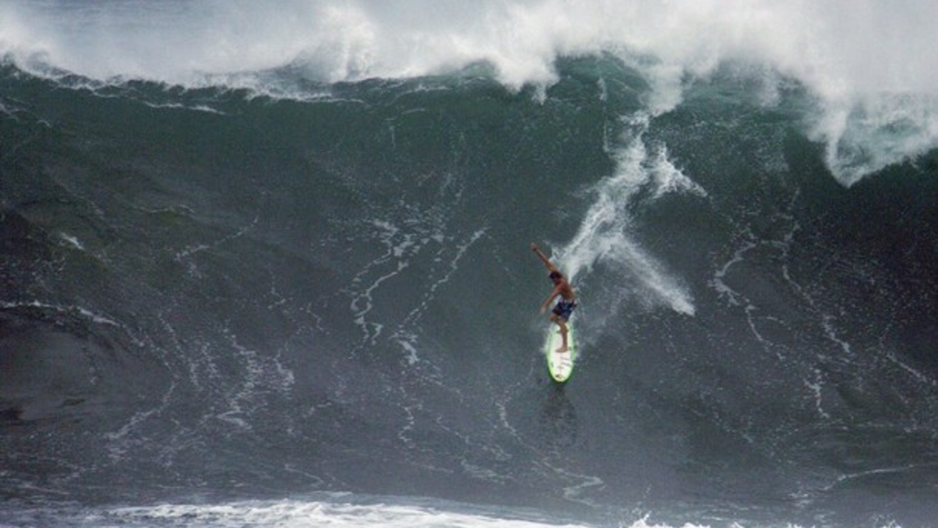 Surfers Take On Giant 30-Foot Waves in Hawaii