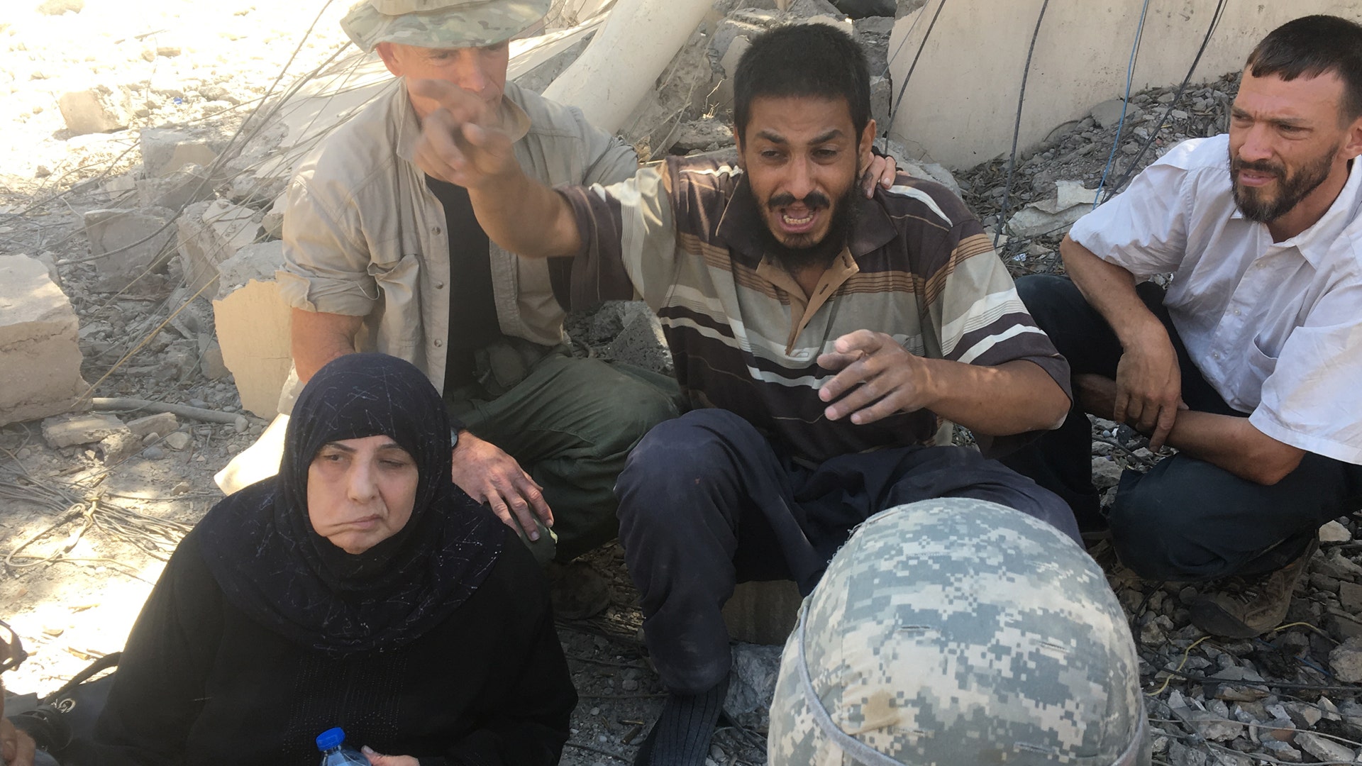 A man tells how his daughters had been shot in front of him by ISIS just minutes prior David Eubank listens, June 1, 2017