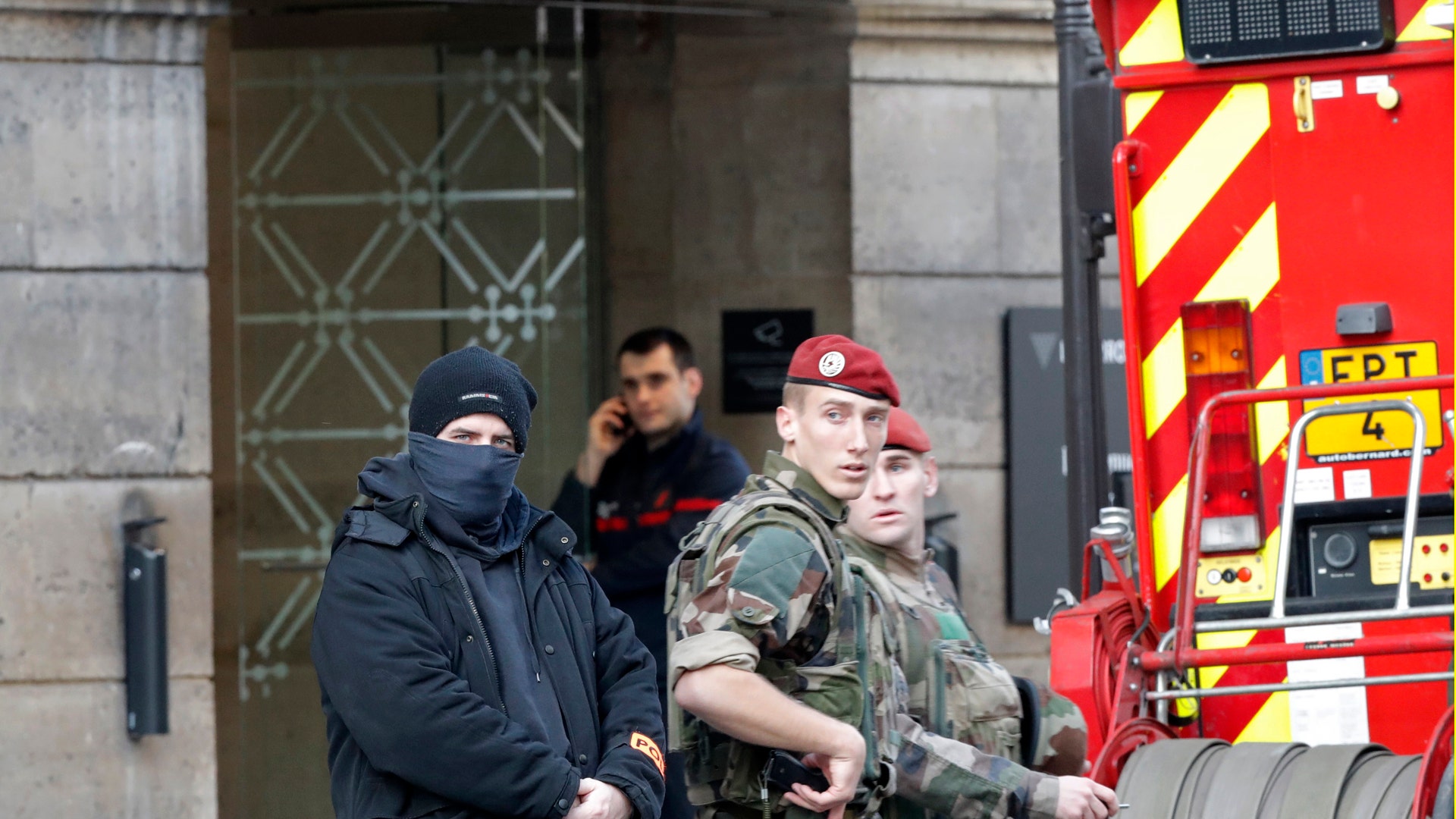 French police, soldiers and firefighters are seen in front of the street entrance of the Carrousel du Louvre in Paris, France, February 3, 2017.