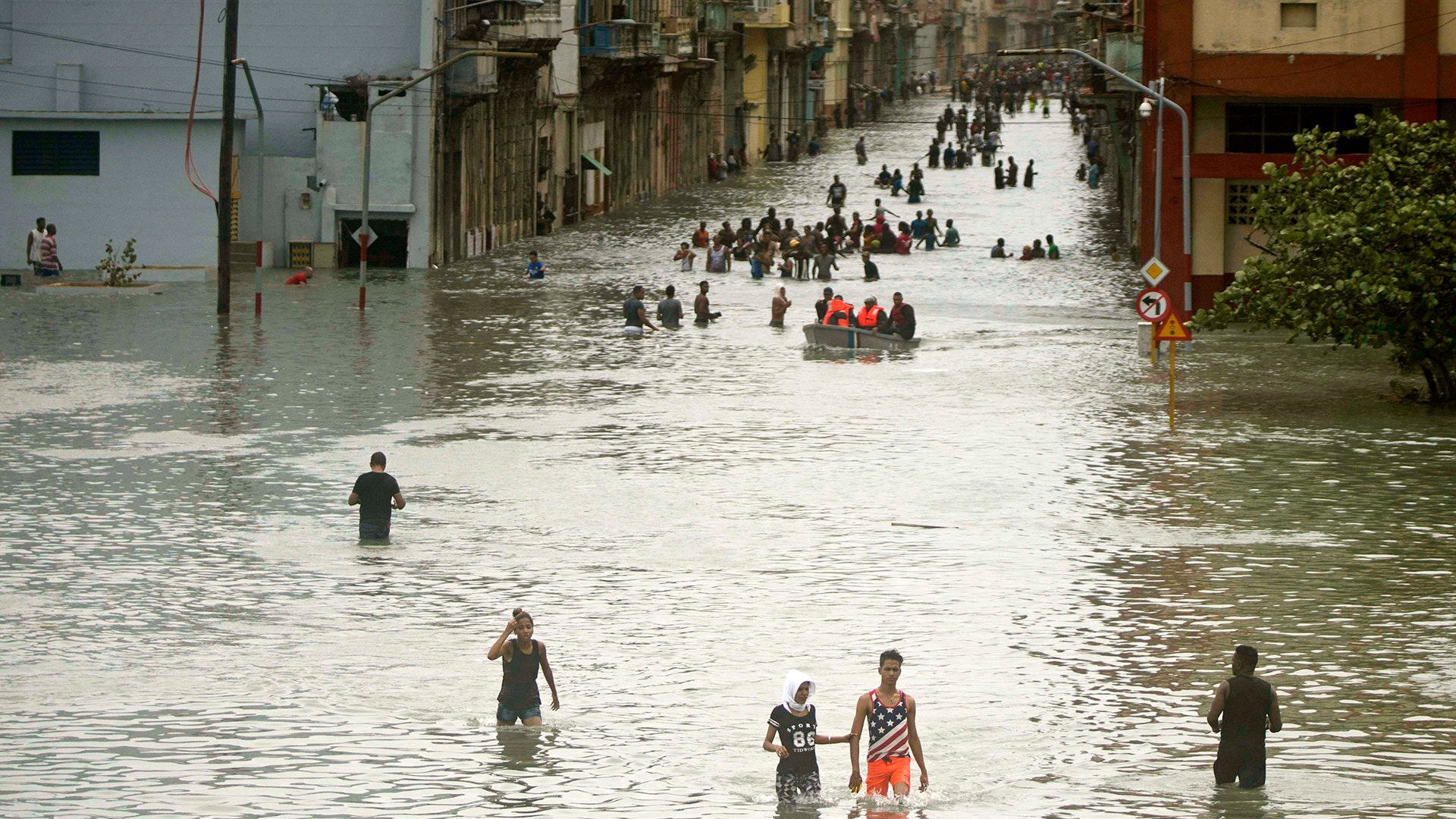 People walk through flooded streets in Havana after the passage of Hurricane Irma in Cuba, September 10, 2017