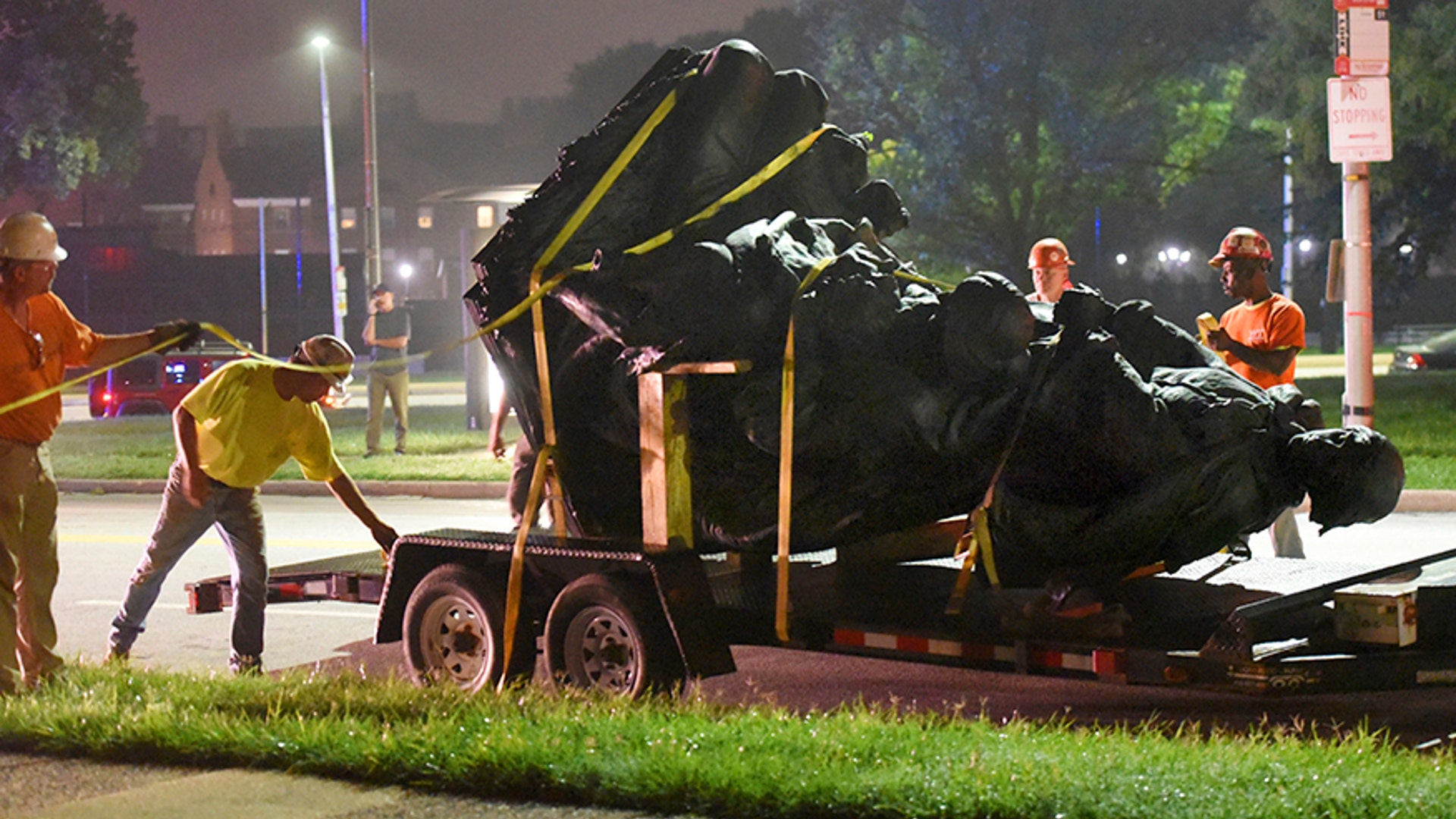 Workers remove a monument dedicated to the Confederate Women of Maryland early Wednesday, Aug 16, 2017