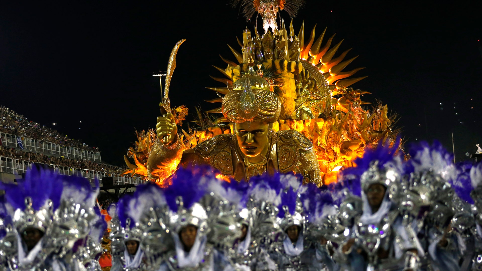 Performers from the Mocidade samba school parade during Carnival celebrations.