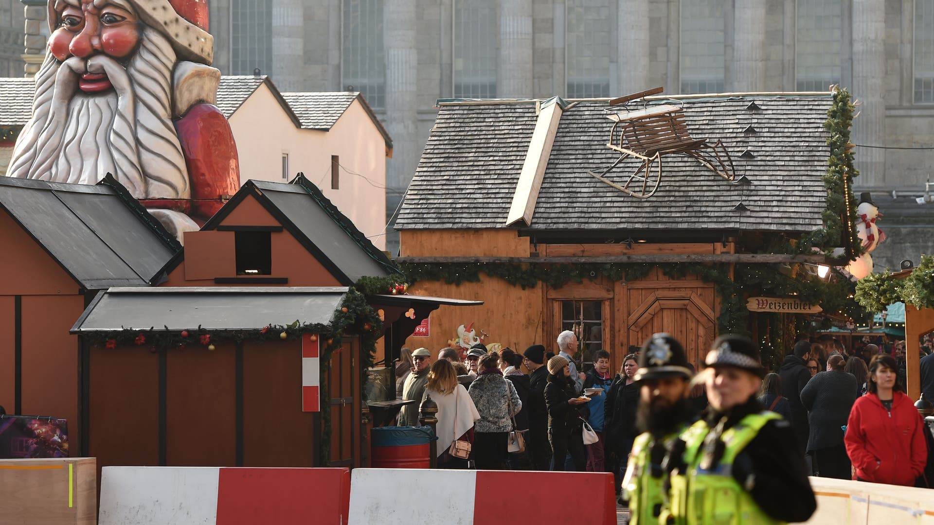 Police patrol German-style Christmas market in Birmingham, England, Tuesday. Police are reviewing security measures and increasing visible patrols following the attack in Berlin.