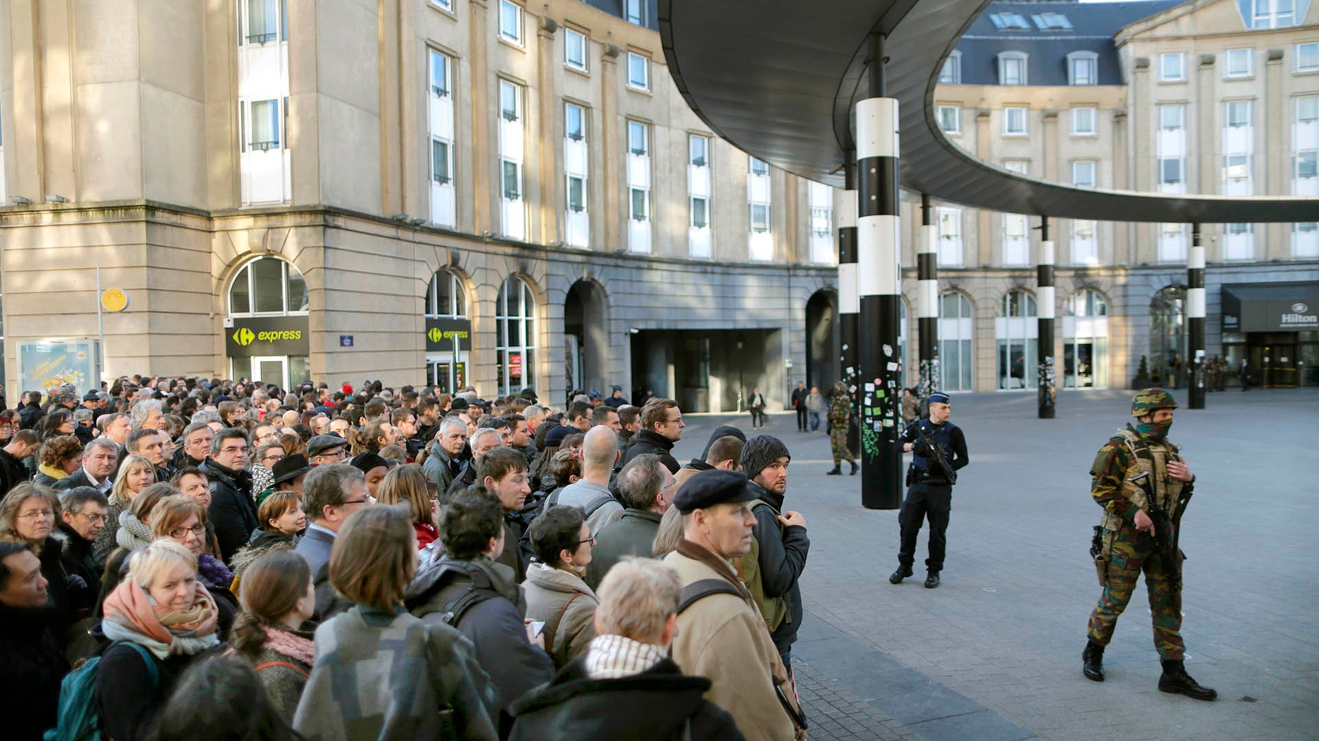 Police control the access to the central train station following bomb attacks in Brussels, Belgium, March 22, 2016. 
