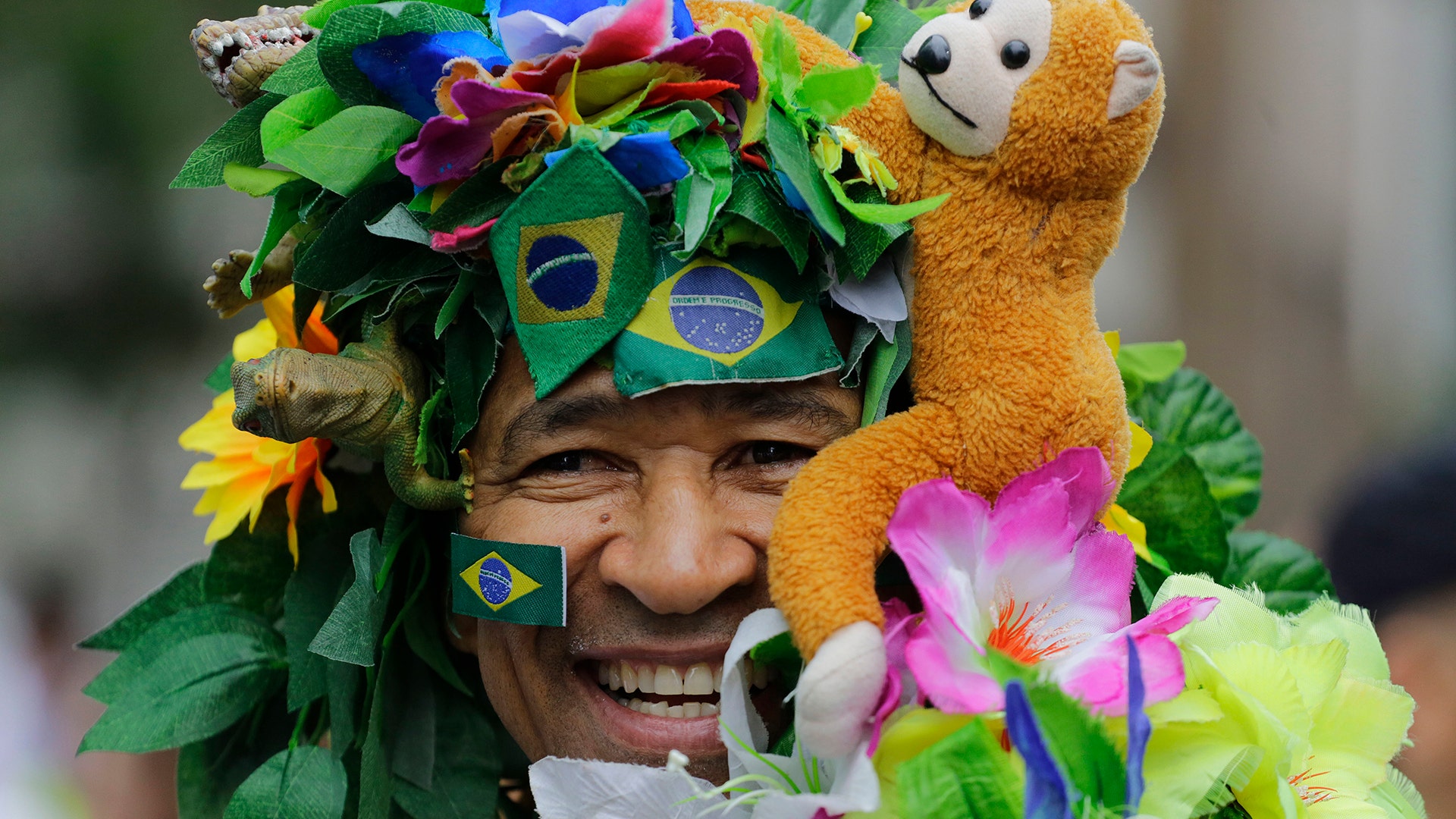 A runner in costume poses for a photo prior to the start of Sao Silvestre race in Sao Paulo, Brazil