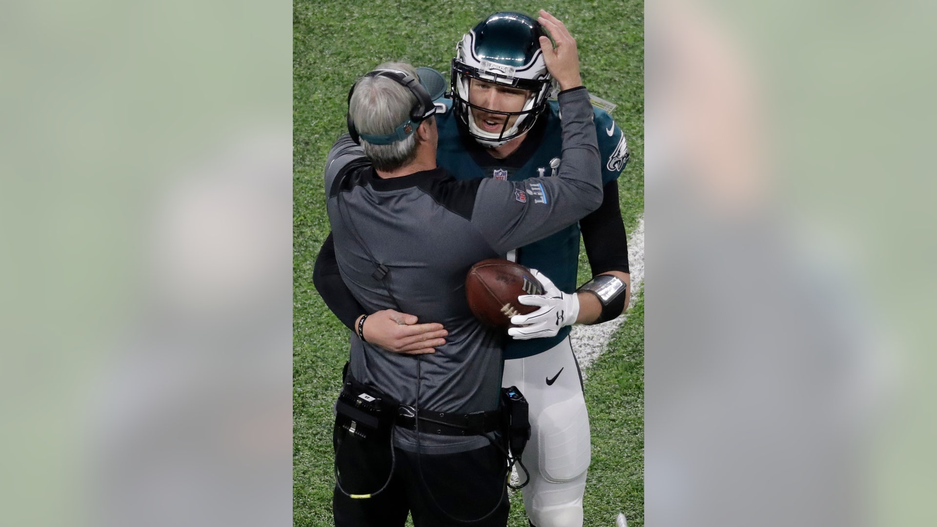 Philadelphia Eagles quarterback Nick Foles celebrates with Eagles head coach Doug Pederson after scoring a touchdown in Super Bowl 52