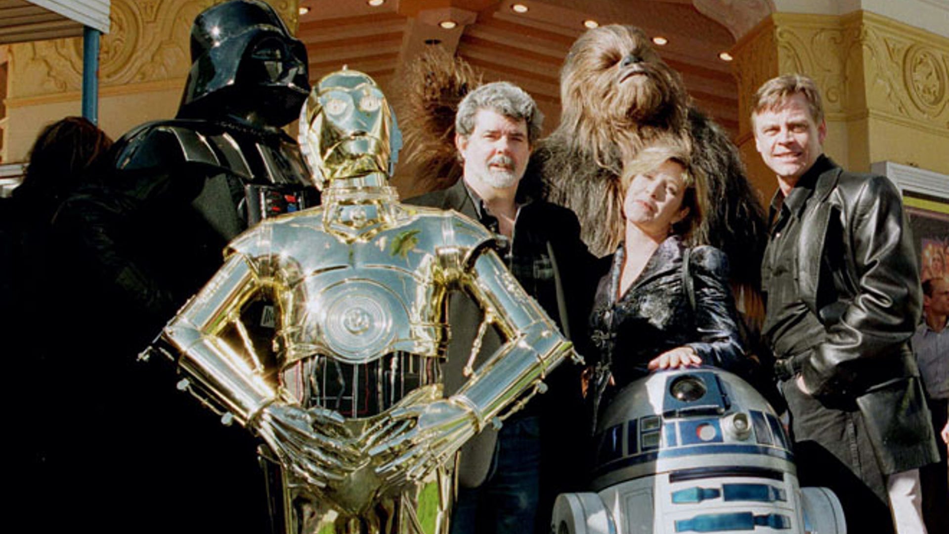 Director and writer of 'Star Wars' George Lucas poses with cast members Carrie Fisher and Mark Hamill in Los Angeles.