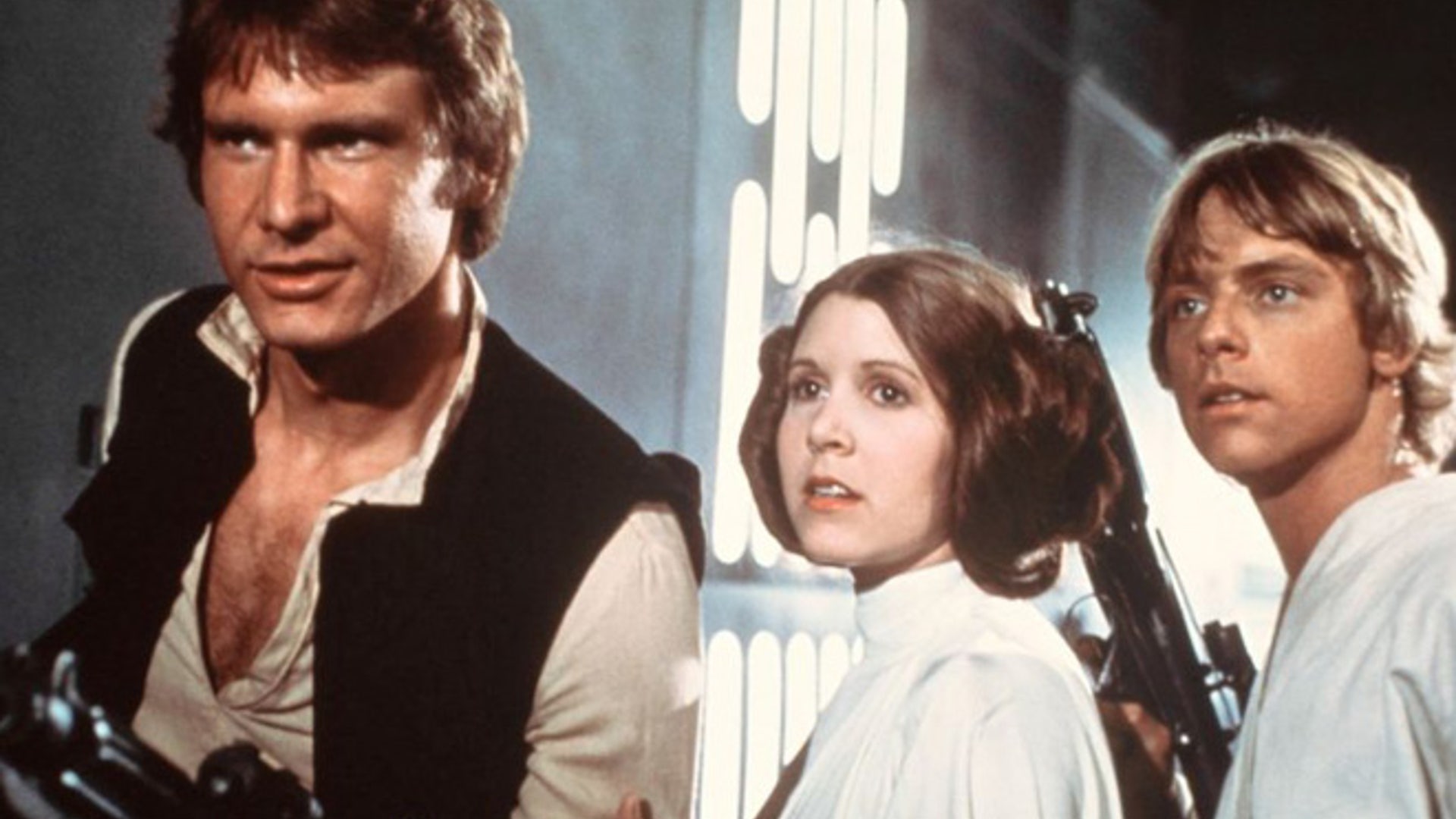 Harrison Ford as Han Solo, Carrie Fisher as Princess Leia Organa and Mark Hamill as Luke Skywalker in a scene from the 'Star Wars'