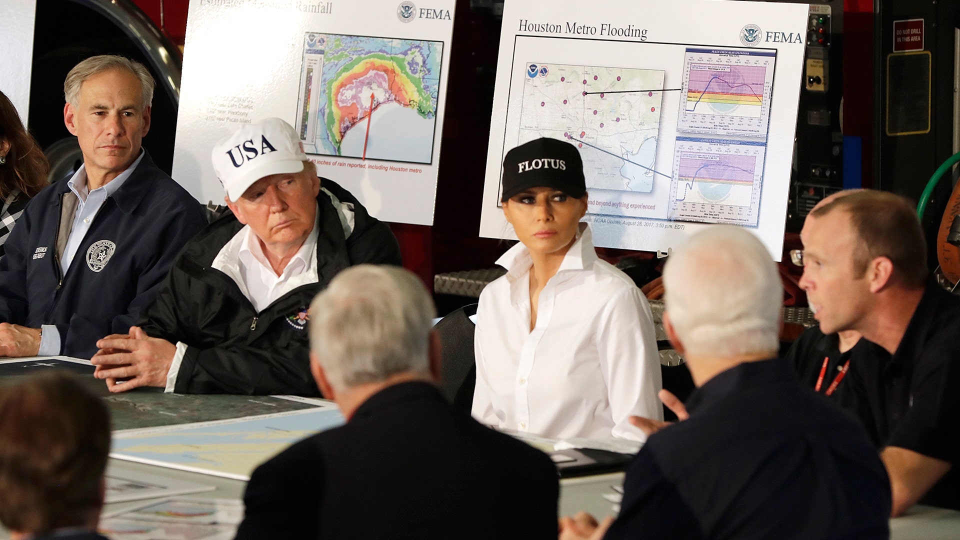 President Donald Trump with Texas Gov. Greg Abbott and first lady Melania Trump at a briefing on Harvey in Corpus Christi, Tuesaday