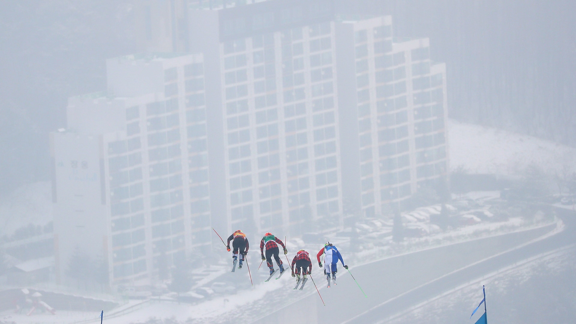Women's ski cross competitors head down the hill at the 2018 Winter Olympics in Pyeongchang