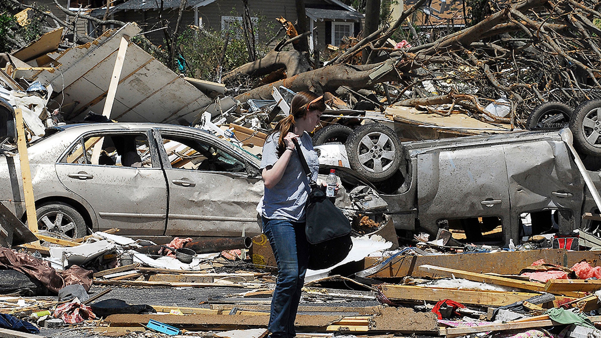 Girl_Among_Upside_Down_Car_AP