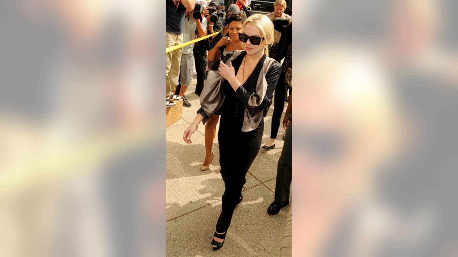 Lindsay enters court full