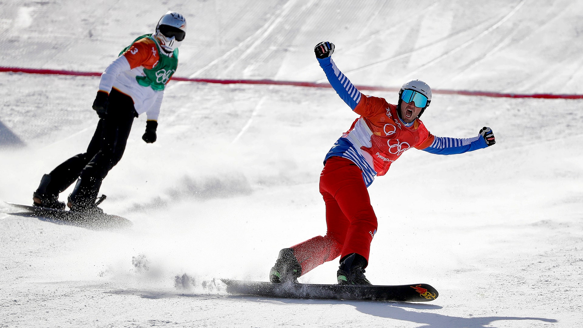 Gold medal winner Pierre Vaultier of France and bronze medal winner Regino Hernandez of Spain in the men's snowboard cross final