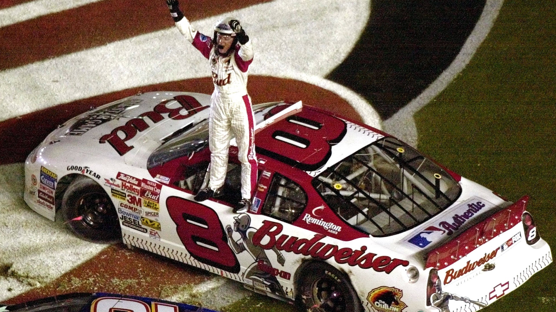 Dale Earnhardt Jr. stands and waves to fans after winning the Pepsi 400 at the Daytona International Speedway July 7, 2001