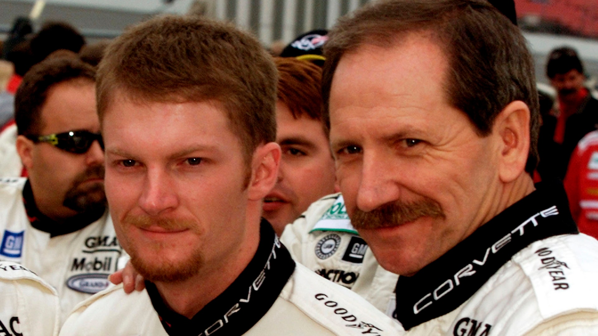 NASCAR drivers Dale Earnhardt (R) and his son, Dale Earnhardt Jr., pose for pictures February 3, 2001