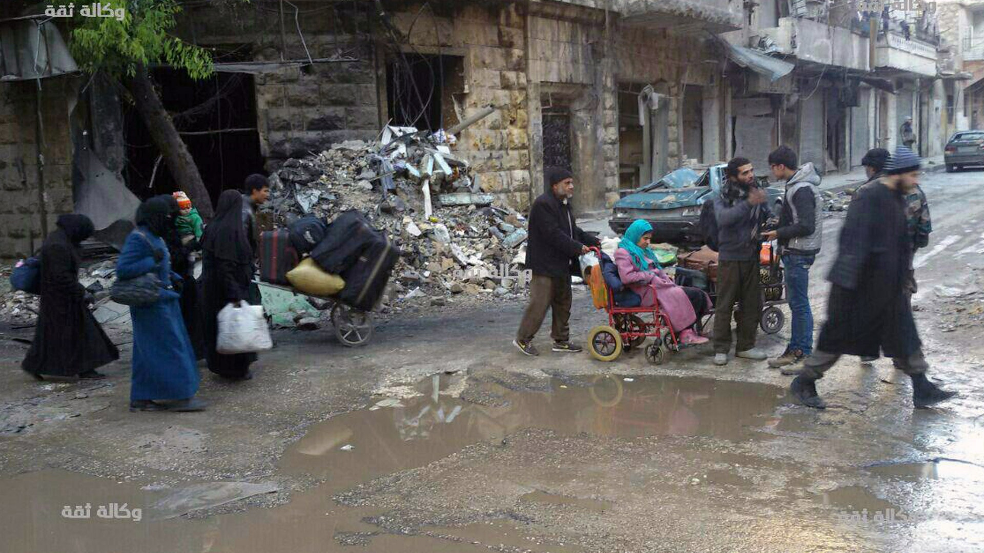 Civilians gathering for evacuation from eastern Aleppo, Syria, Thursday, Dec. 15, 2016, in this image released by the Thiqa News Agency. 