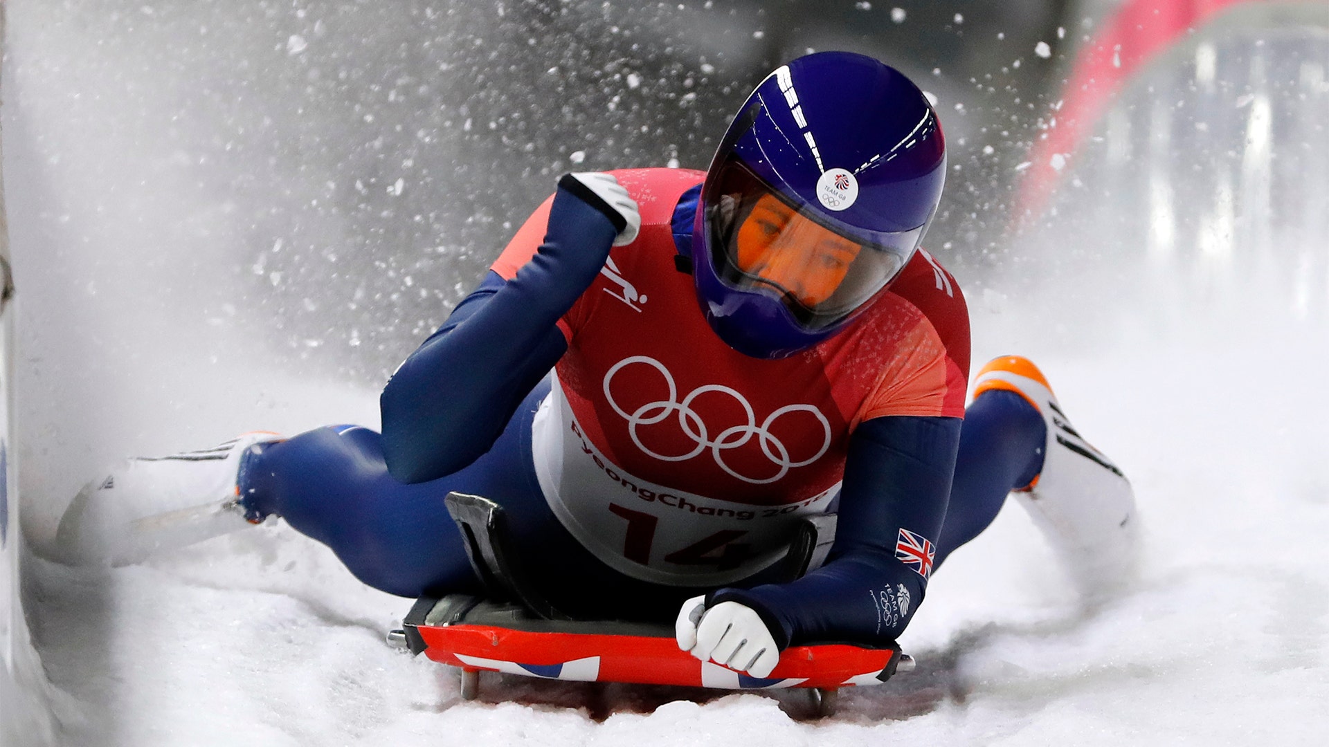 Lizzy Yarnold of Britain celebrates her gold medal winning run in the finish area after the final run of the women's skeleton