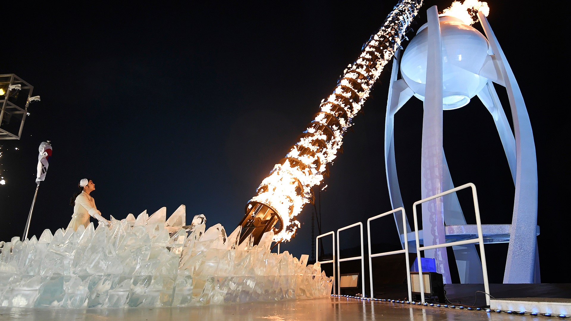 South Korean Olympic figure skating champion Yuna Kim lights the Olympic flame at the Pyeongchang Winter Olympics