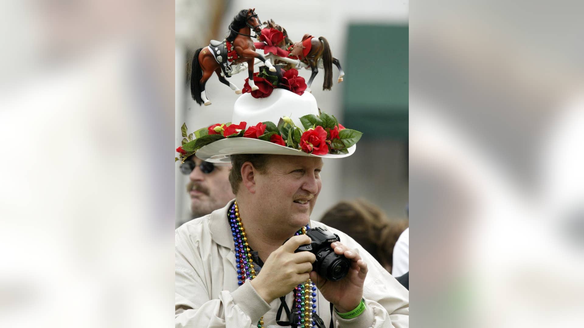 Race horse and rose-adorned hat