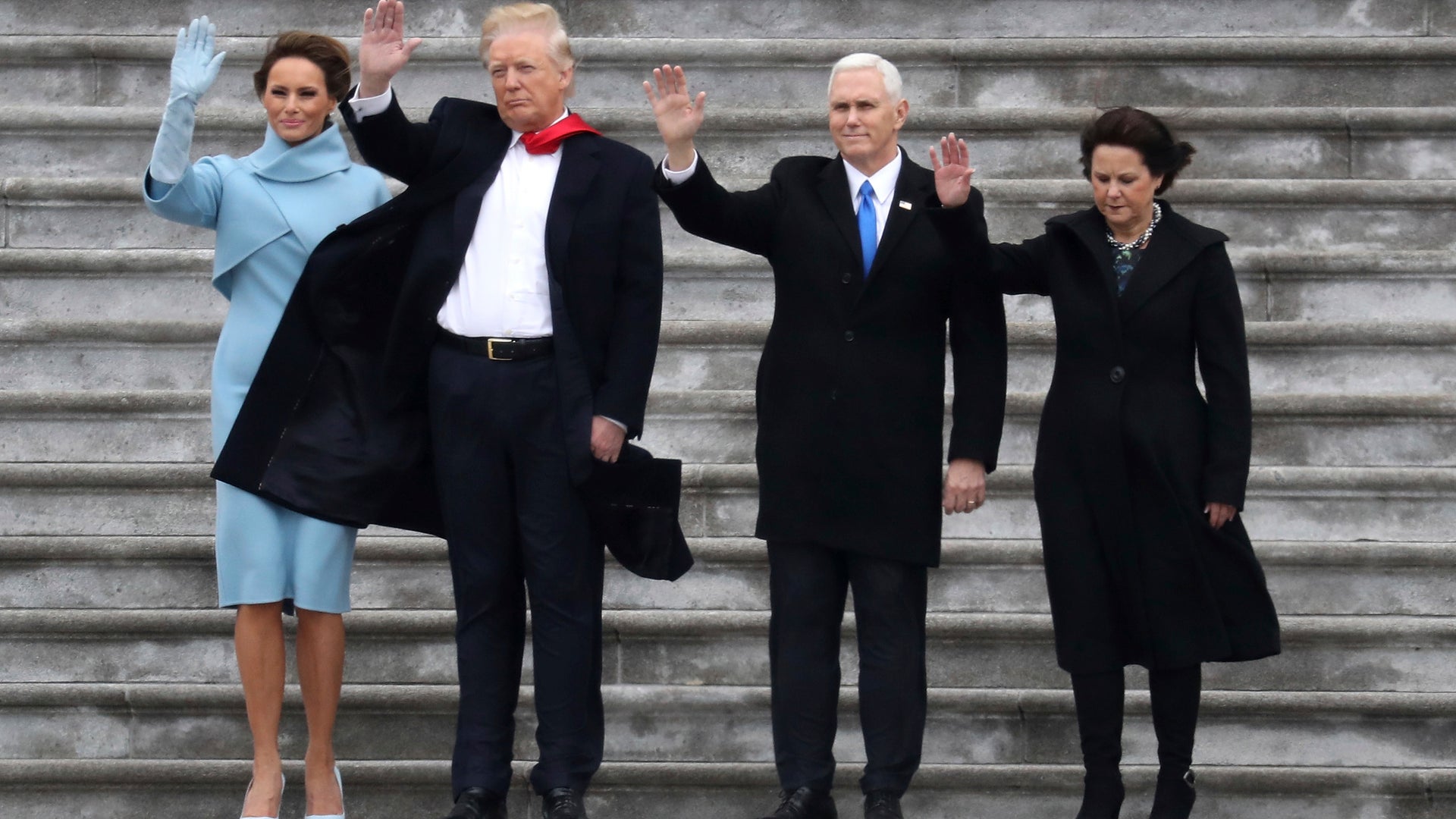 First lady Melania Trump, President Donald Trump, Vice President Mike Pence and his wife Karen wave to former President Barack Obama as he departs in a Marine helicopter on the East Front of the U.S. Capitol in Washington.