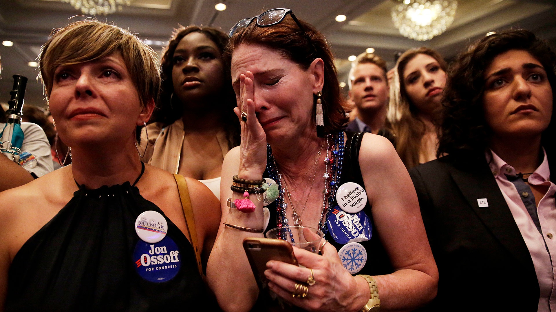 Supporter Jan Yanes cries as Democratic candidate for 6th congressional district Jon Ossoff concedes to Republican Karen Handel
