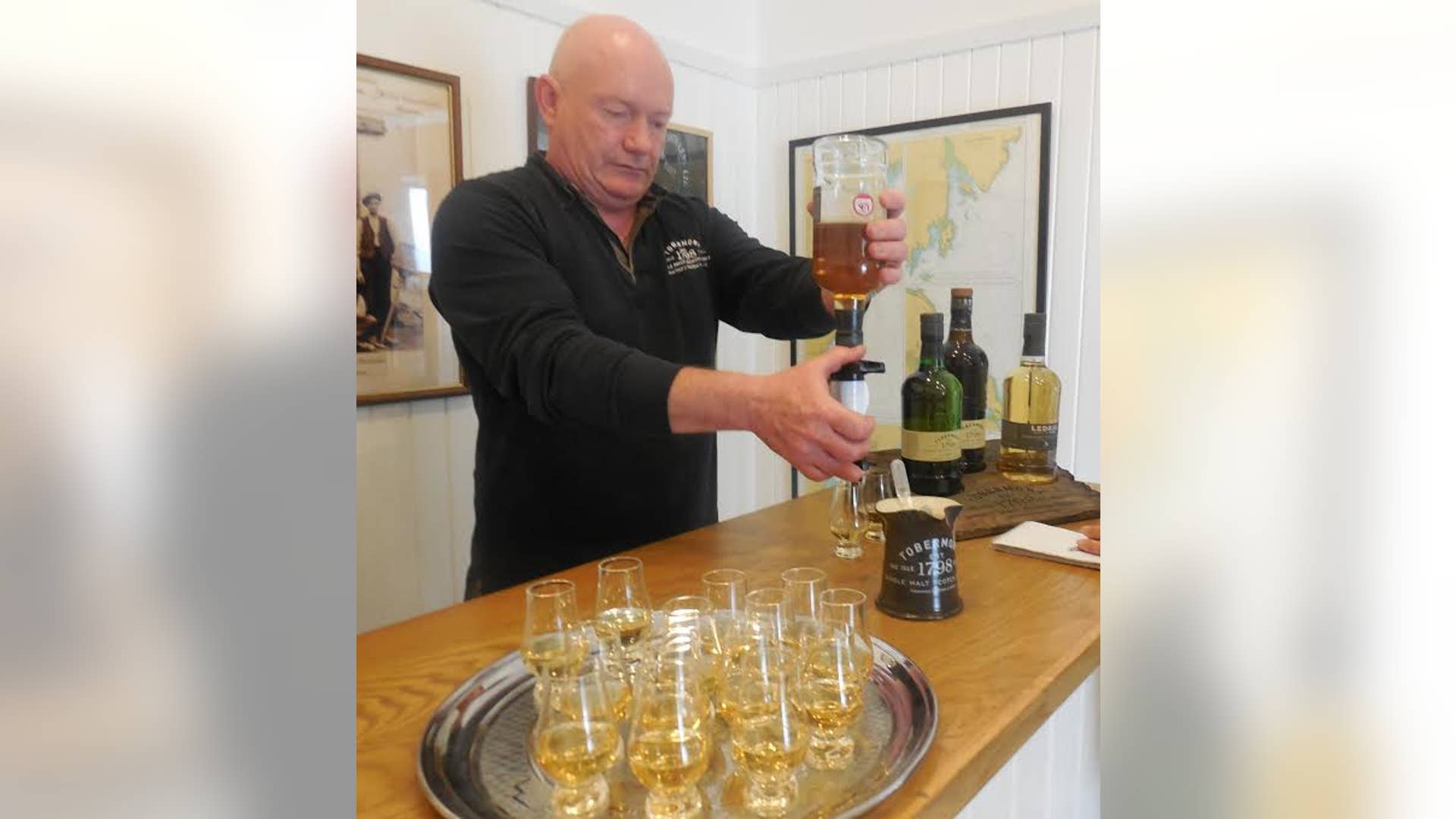 Craig Murray pouring Scotch tasting at Tobermory Distillery