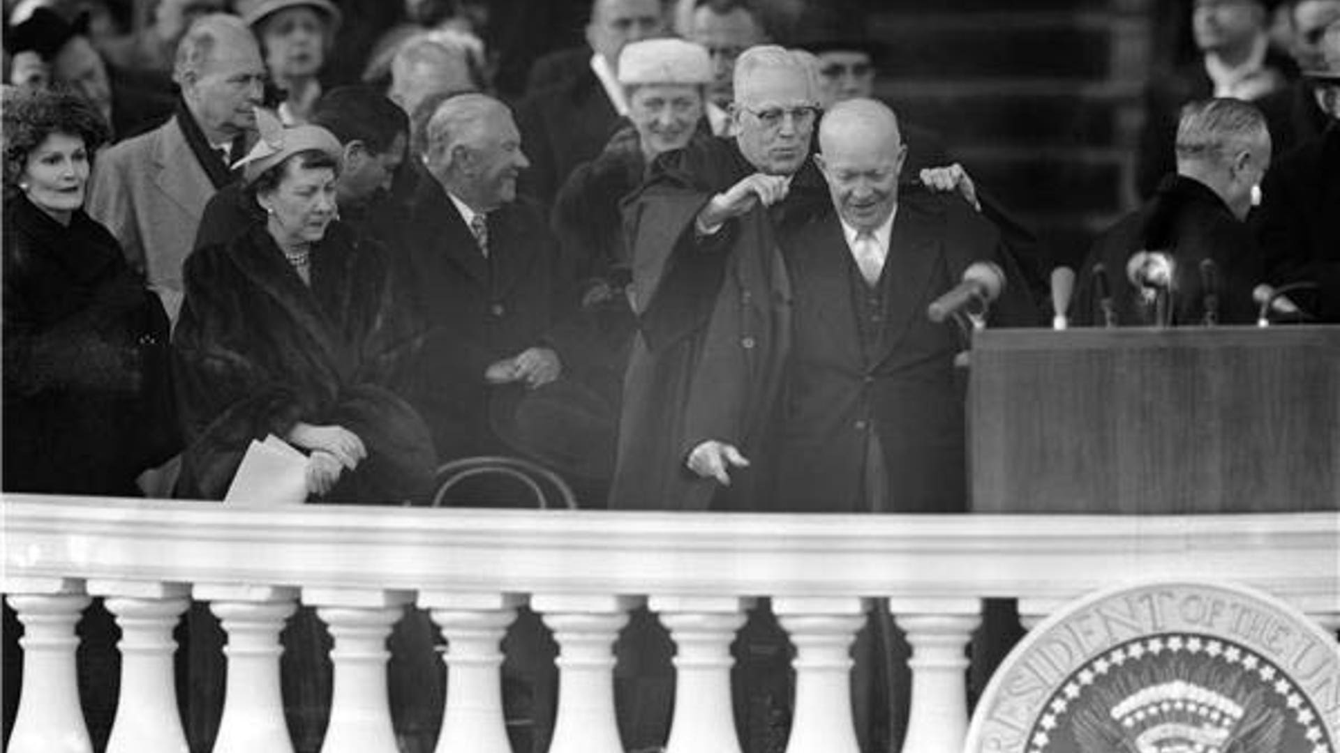 Chief justice Earl Warren helps President Dwight Eisenhower at his inaugural address at the Capitol in Washington, D.C. on Jan. 21, 1957.