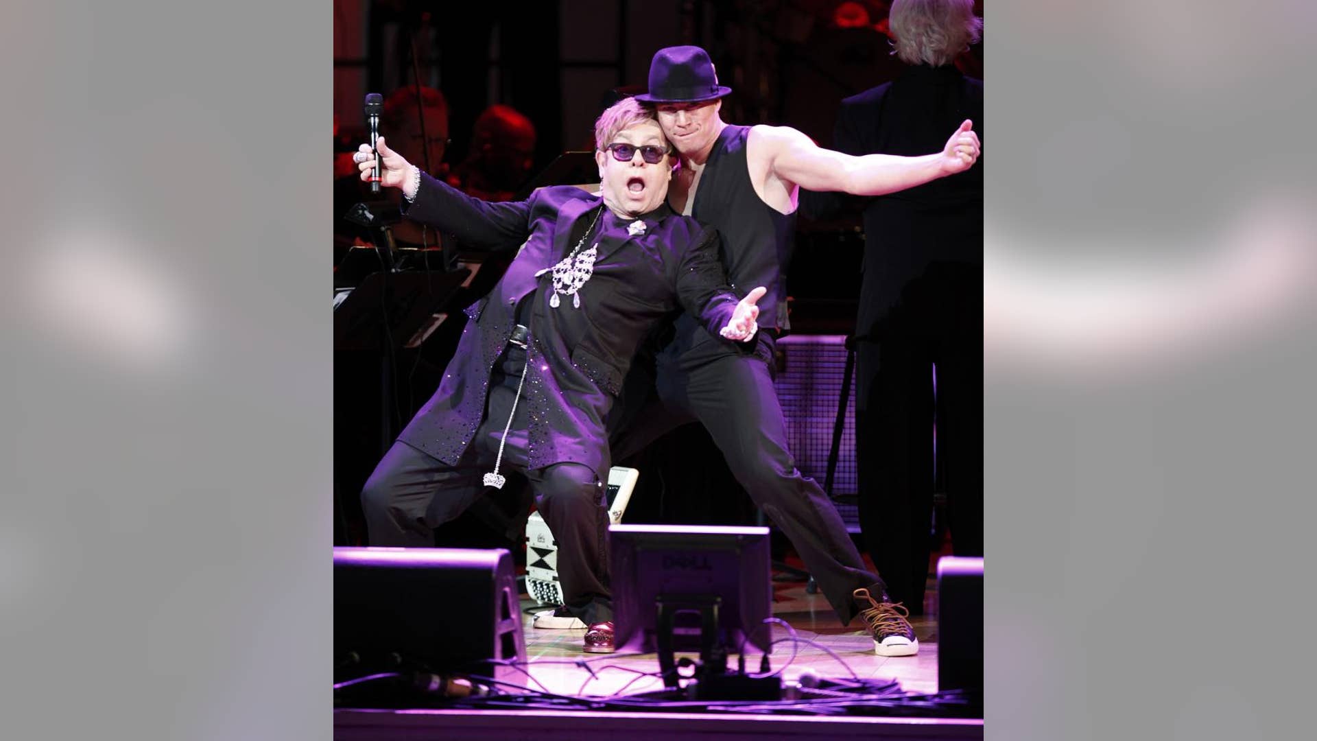 Performing with Elton John