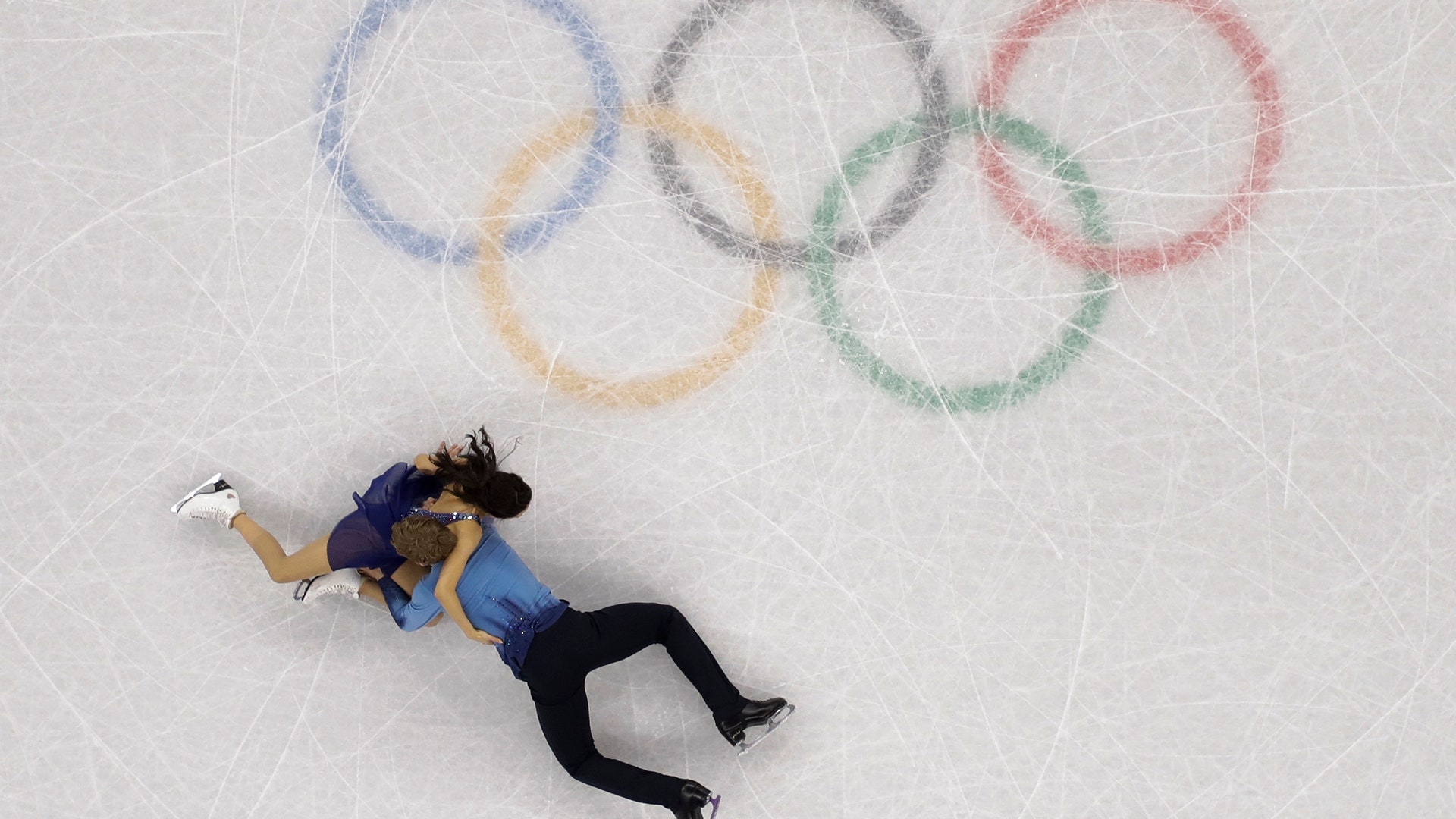 Madison Chock and Evan Bates of the United States fall during the ice dance, free dance figure skating final at the Winter Olympics