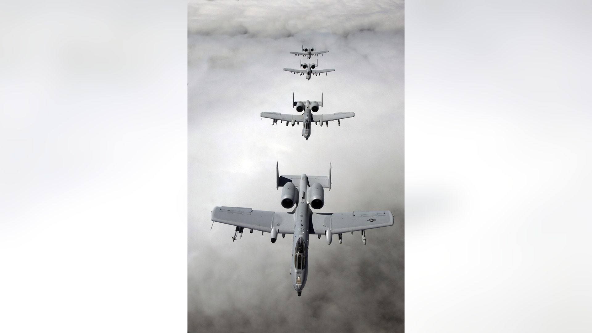 Four A-10 Thunderbolt II aircraft in formation