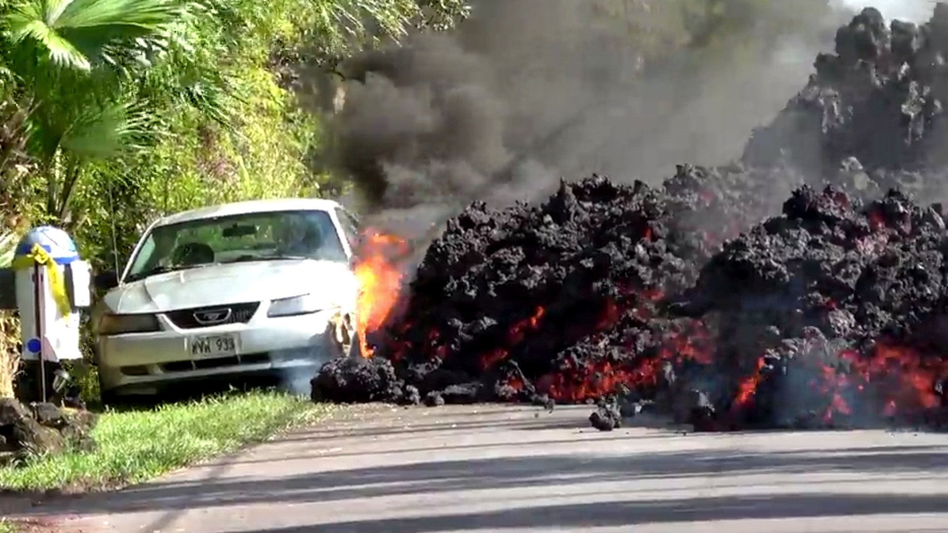 Lava engulfs a Ford Mustang in Puna, Hawaii, May 6, 2018