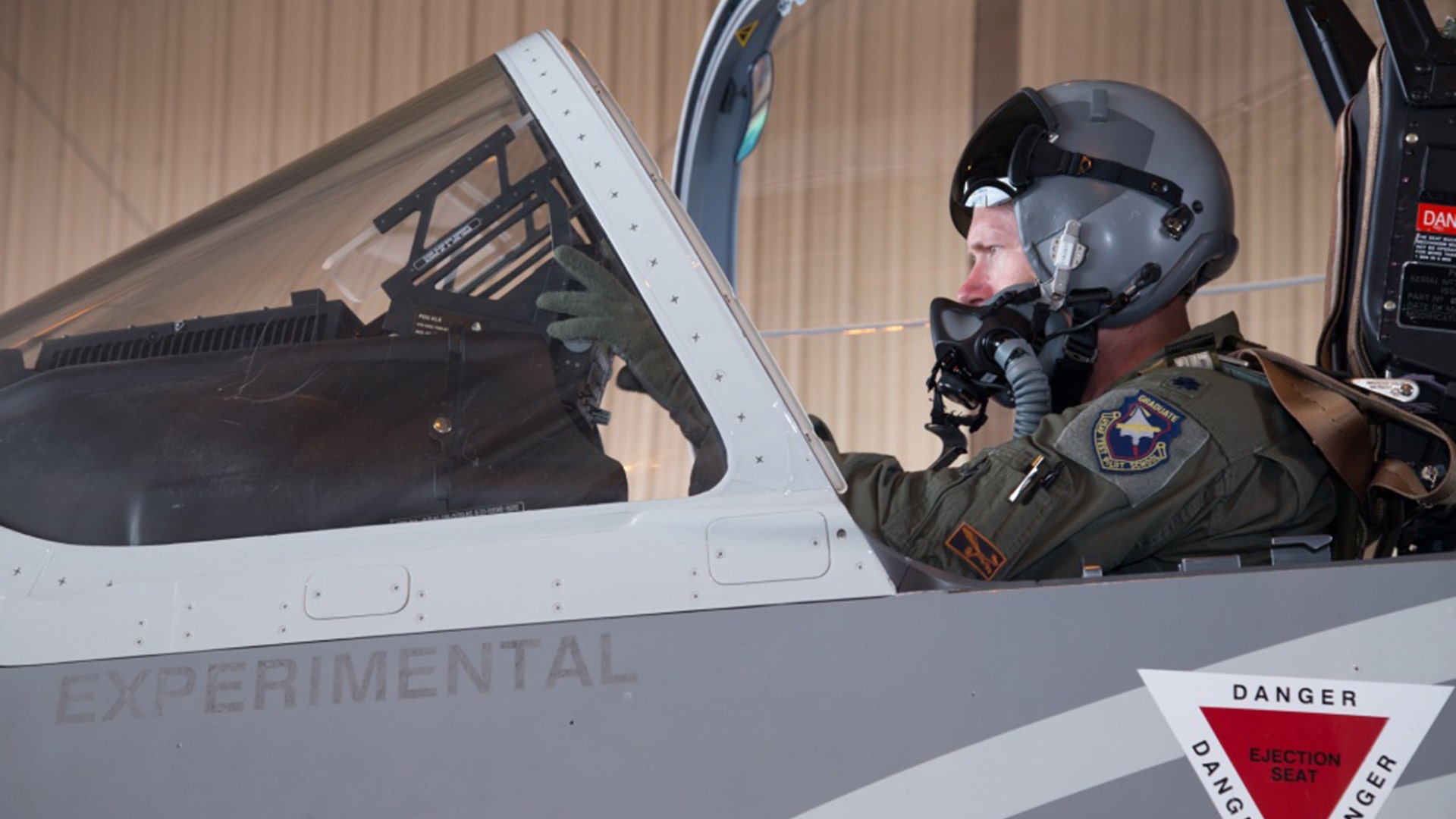U.S. Air Force test pilot Lt. Col. Lane Odom prepare to fly an Embraer A-29 experimental aircraft at Holloman AFB, NM, on July 31, 2017.