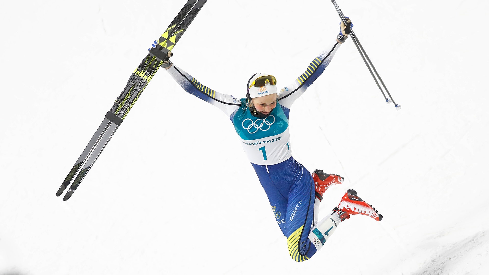 Stina Nilsson of Sweden celebrates after winning the gold medal in the women's sprint classic at the 2018 Winter Olympics