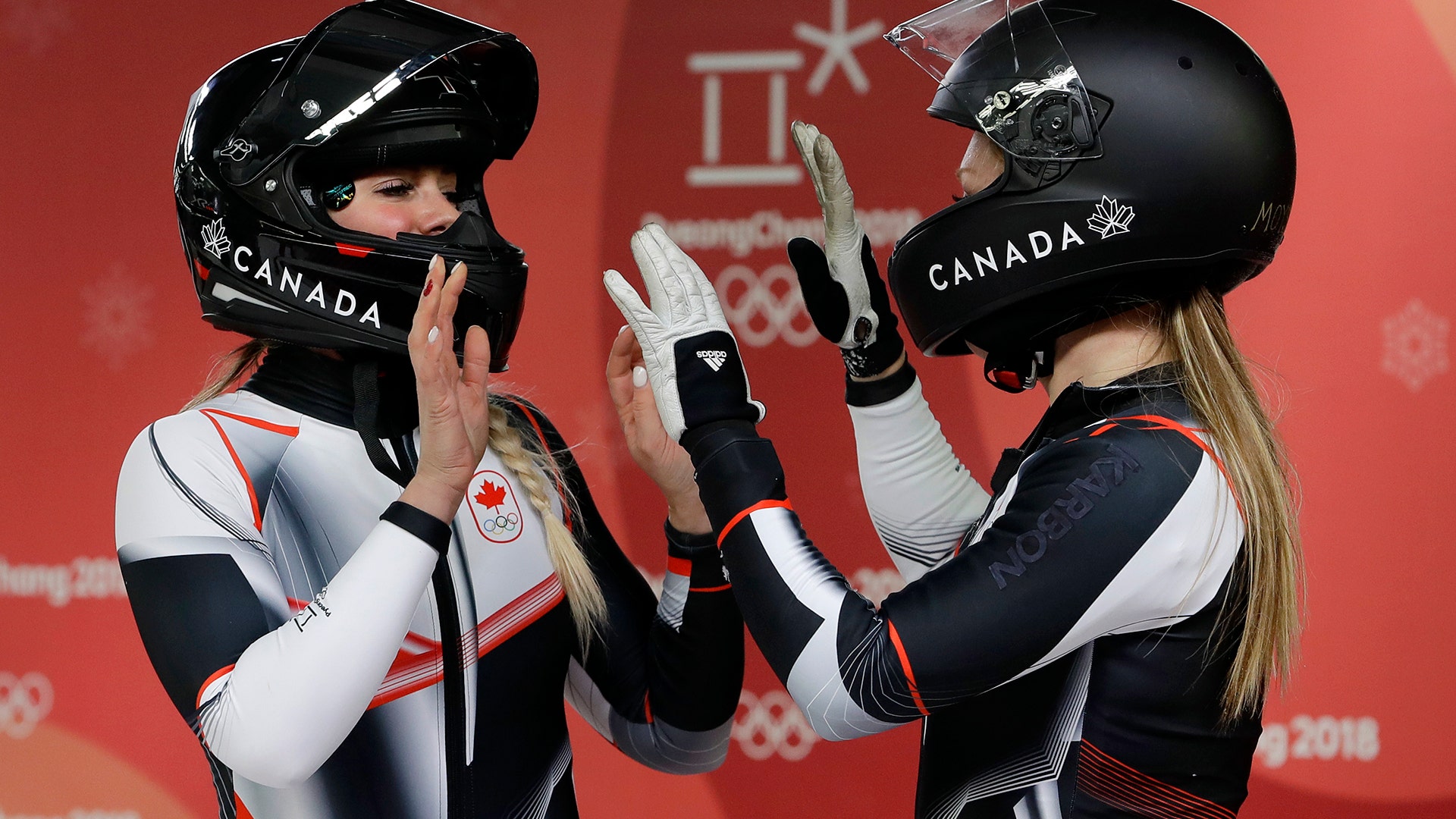 Alysia Rissling and Heather Moyse of Canada finish their second heat during the women's two-man bobsled at the 2018 Winter Olympics
