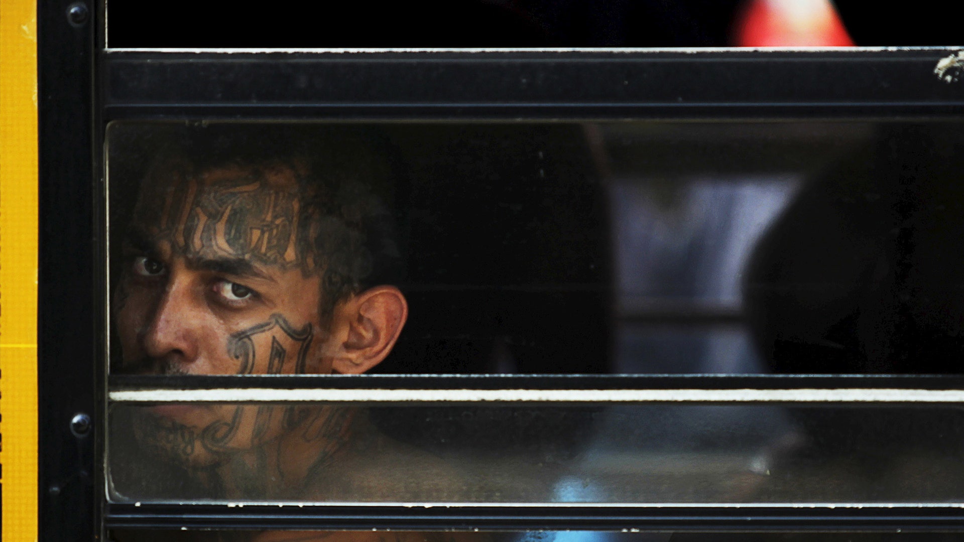  Barrio 18 gang waits to be admitted upon their arrival to the San Francisco Gotera penitentiary 
