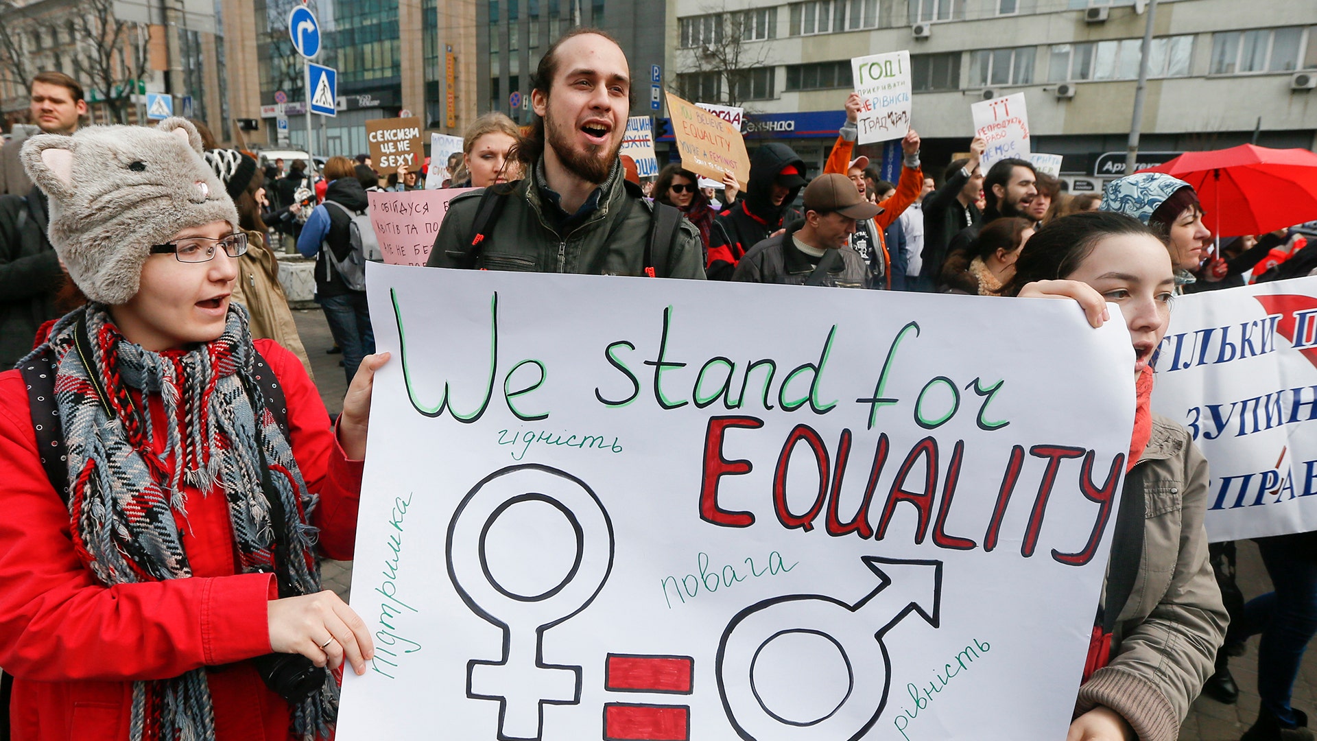Demonstrators hold a placard during a rally for gender equality and against violence towards women on International Women's Day in Kiev, Ukraine 