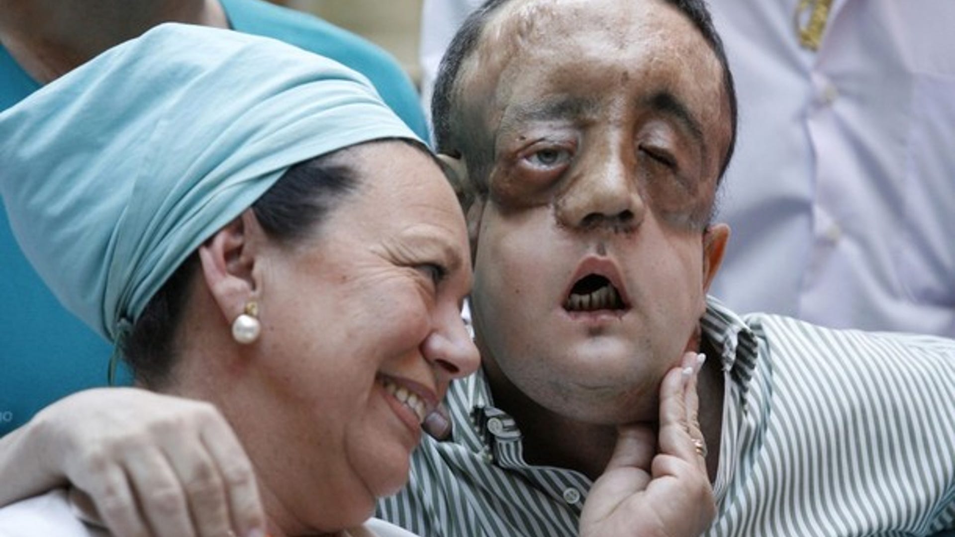 Rafael Embraces a Nurse