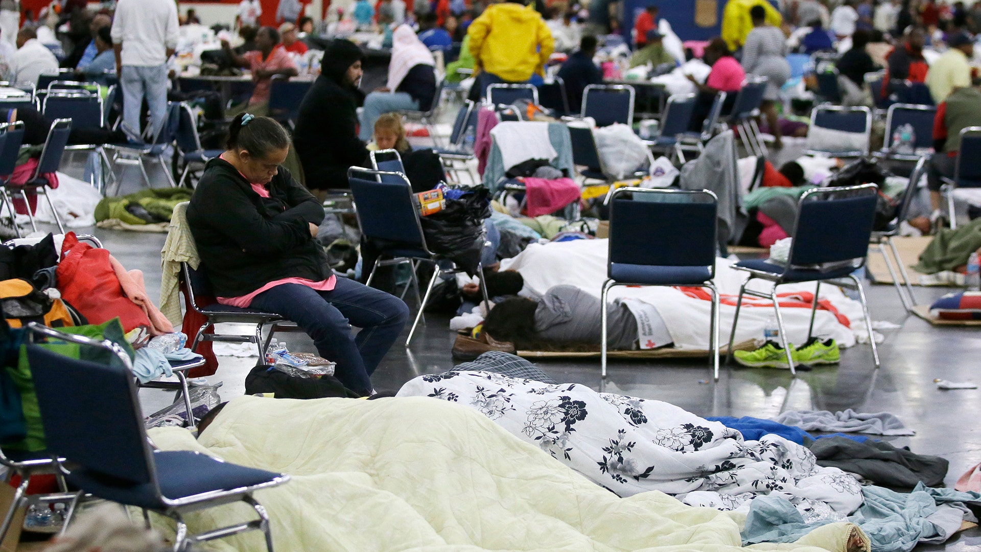 People at the George R. Brown Convention Center for evacuees escaping the floodwaters from Tropical Storm Harvey in Houston, Tuesday