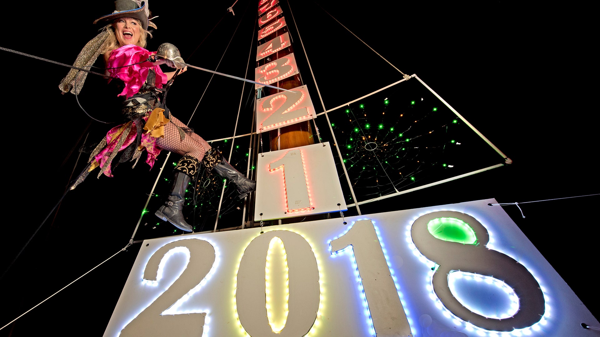 Evalena Worthington practices her New Year's Eve descent from the top of a sailing vessel's mast in Key West, Florida