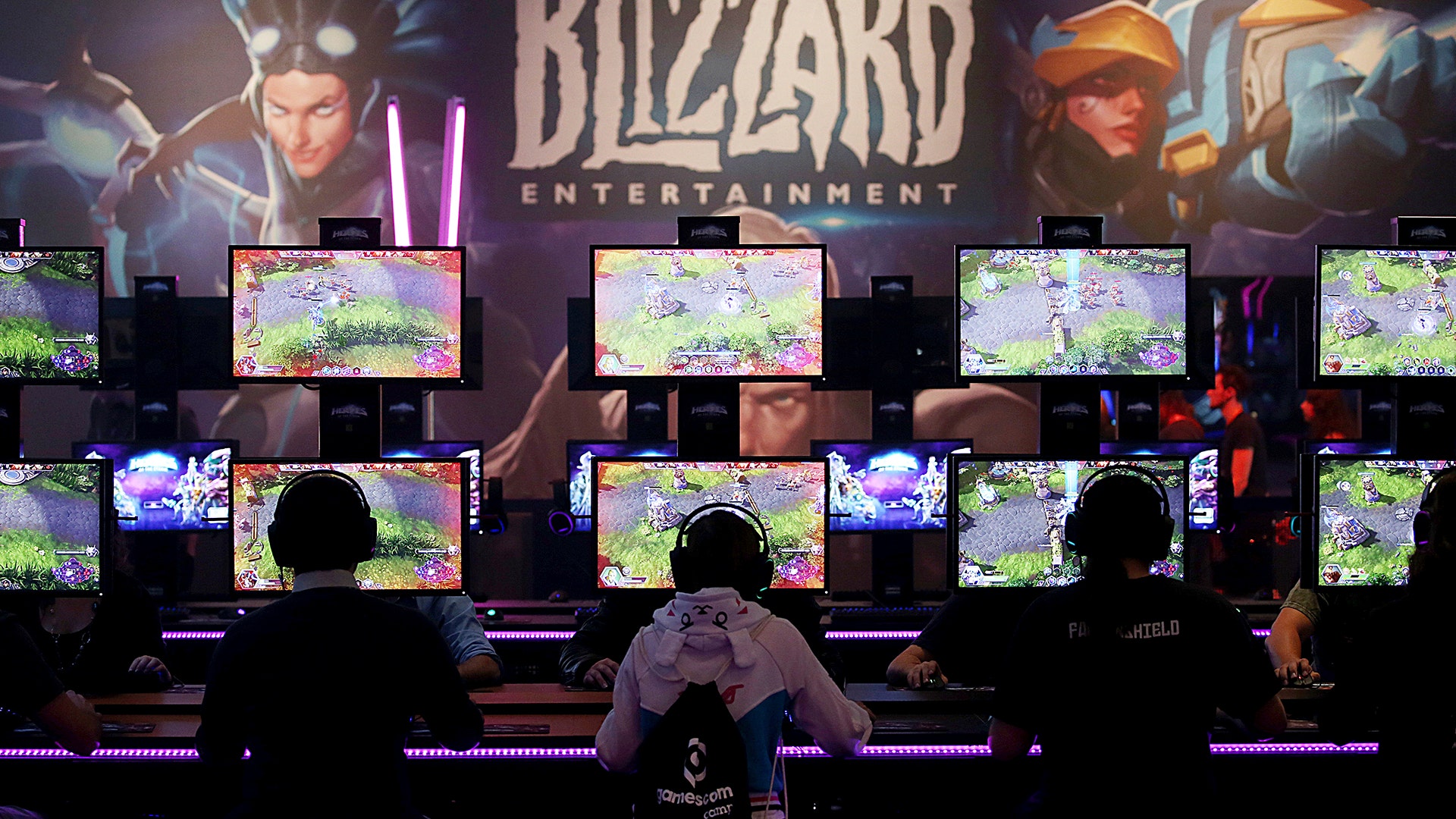 Gamers test out computer games at Gamescom in Cologne, Germany, Aug. 22, 2017