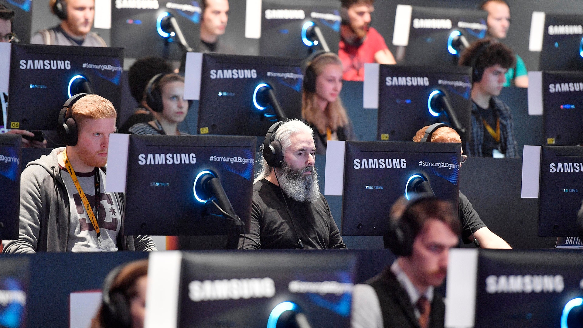 Visitors try out the latest video games at the Gamescom 