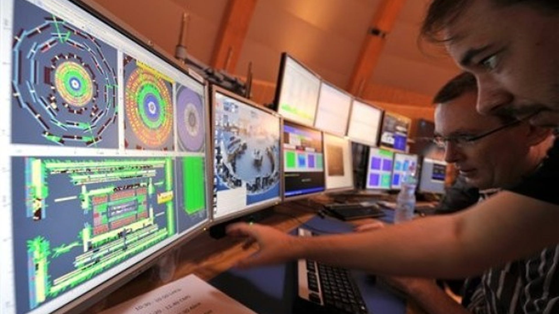 Scientists in control room of Large Hadron Collider