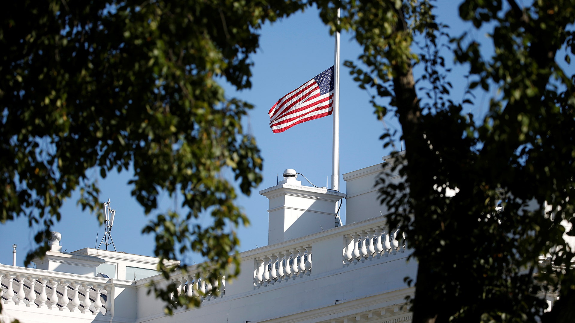 The U.S. flag flies at half-staff in the wake of a mass shooting
