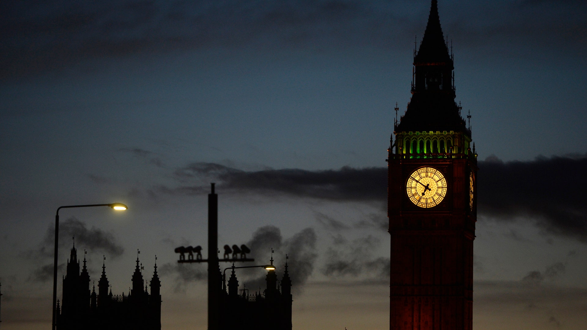 The sun sets behind the Houses of Parliament after an attack on Westminster Bridge in London, Britain March 22, 2017